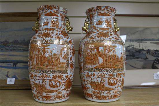 A pair of Chinese iron red and gilt porcelain vases, 19th century mounted as lamps